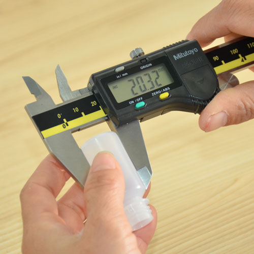 Digital caliper measuring a molded plastic component